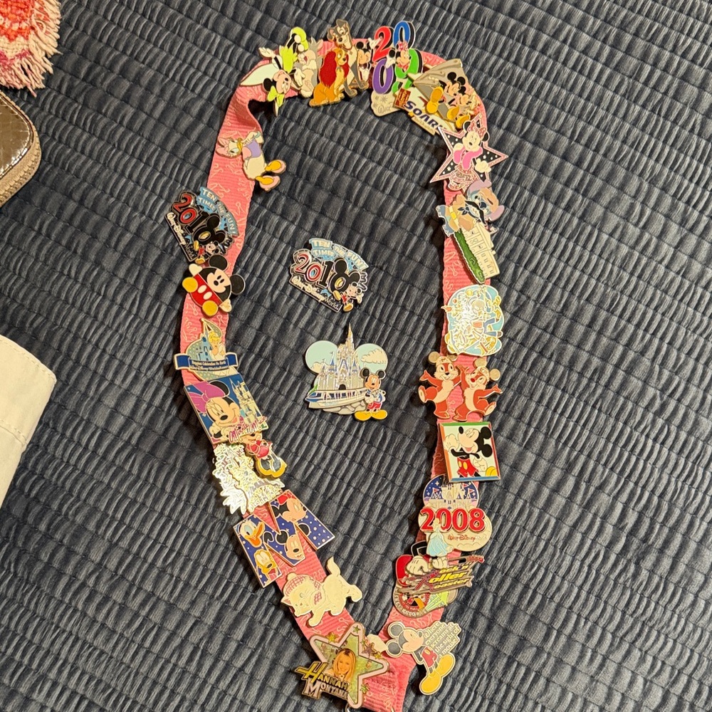 Disney Pin Collection on Pink Lanyard